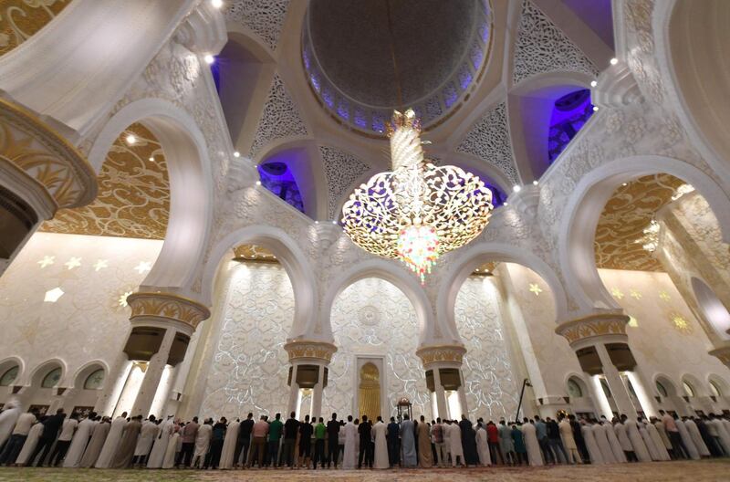 Worshippers pray inside Abu Dhabi's Sheikh Zayed Grand Mosque on the last Friday of Ramadan. Karim Sahib / AFP