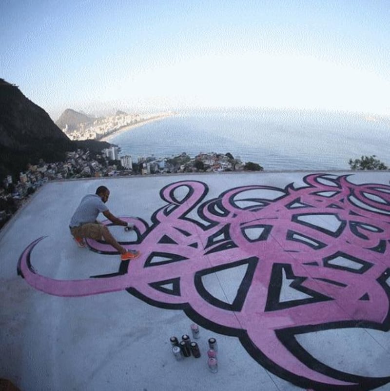 Vidigal Favella, Brazil: the street calligrapher didn't know he was painting on the rooftop of an art school in Brazil's Vidigal Favella, he revealed on Instagram. 'Few days after I left Brazil, I received notifications from a post by Vik Muniz saying 'This morning, the roof of the school was painted with this huge tag by an unidentified artist, and I must say, it's quite beautiful [...] Thanks, awesome tagger.' Out of all the houses in the favela, I had to paint on the school of the renowned Brazilian artist.' Instagram / eL Seed