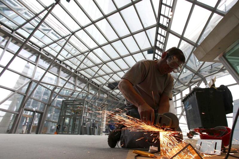 A builder works inside the new headquarters of the European Central Bank. Ralph Orlowski / Reuters