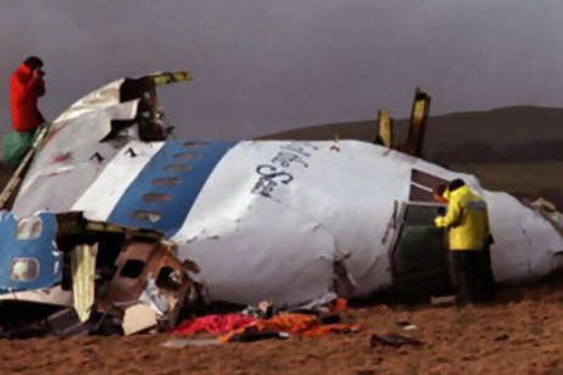 A file photo of police and investigators examining what remains of the flight deck of Pan Am 103 on a field in Lockerbie, Scotland, in this Dec 22 1988. Libya paid $1.5 billion to compensate victims of terrorism.