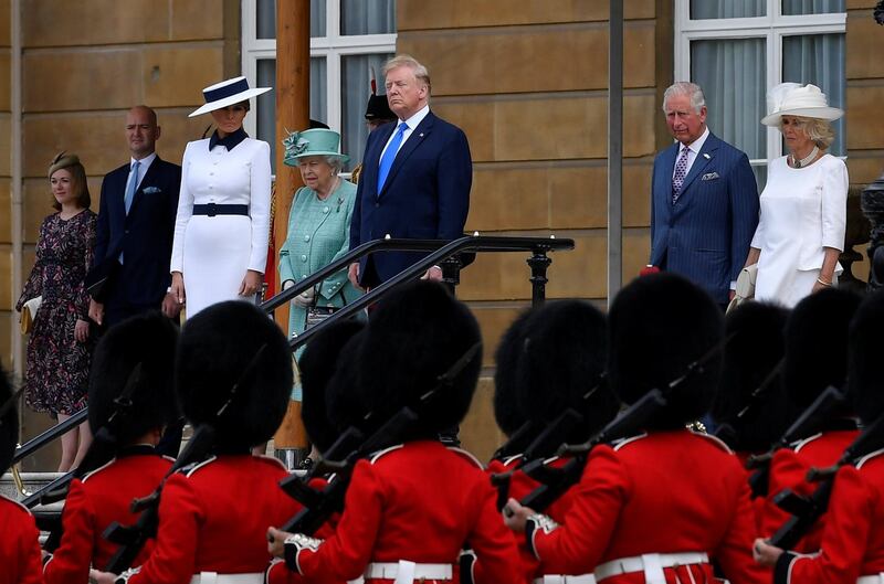 (L-R) US First Lady Melania Trump, Britain's Queen Elizabeth II, US President Donald Trump, Britain's Prince Charles, Prince of Wales and Britain's Camilla, Duchess of Cornwall watch guardsmen parade during a welcome ceremony at Buckingham Palace in central London. AFP