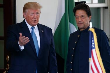 US President Donald Trump gestures as he greets Pakistan's Prime Minister Imran Khan at the White House. AP Photo
