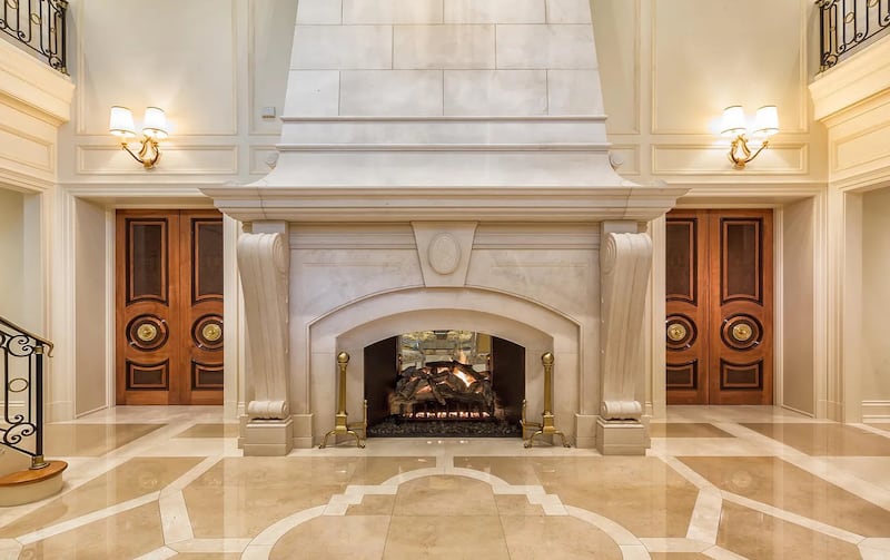 A 24-foot limestone fireplace dominates the vestibule
