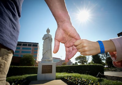 Holding hands near statue of St Jude
Photo: stjude.org