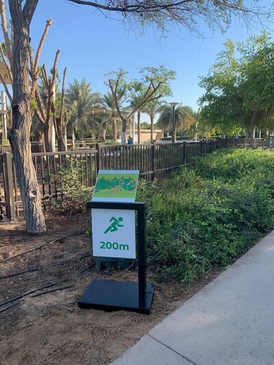 Umm Al Emarat Park's new jogging track has distance markers to help joggers track their progress. Courtesy Umm Al Emarat Park