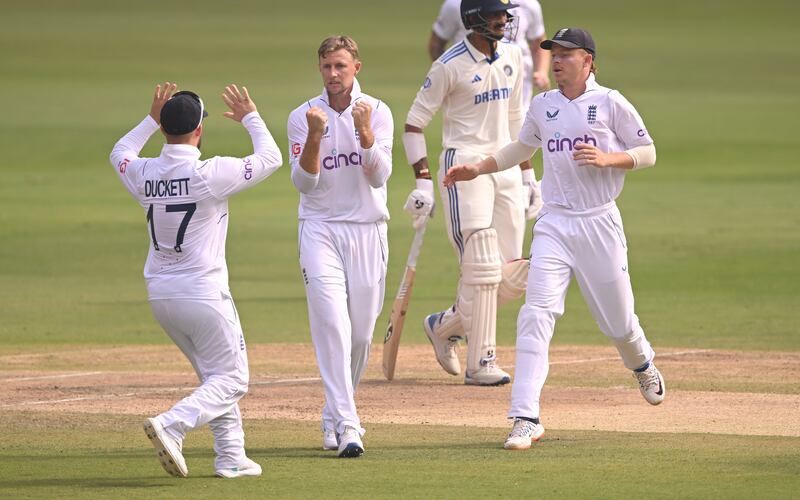 England bowler Joe Root celebrates with team mates after taking the wicket of India's Ravindra Jadeja. Getty Images