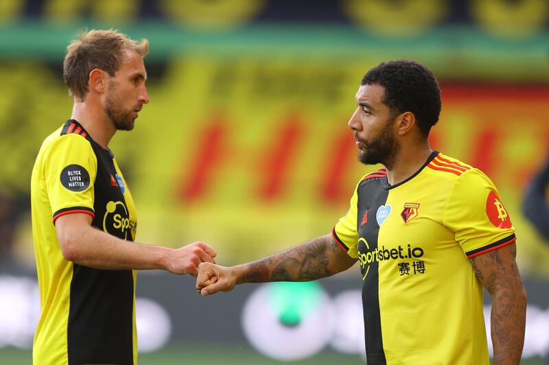 Watford's Craig Dawson shakes hands with Troy Deeney after the match. Getty