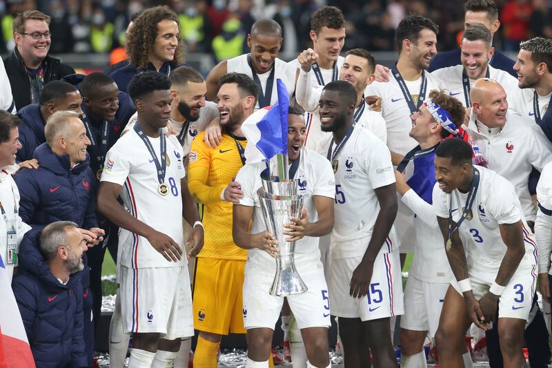 France players celebrate with the trophy. EPA