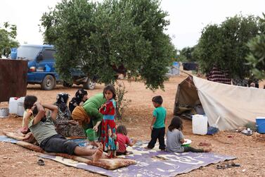 Some of the families displaced by Syrian regime attacks in Idlib have taken refuge in an olive grove in the province's Harem district. AFP