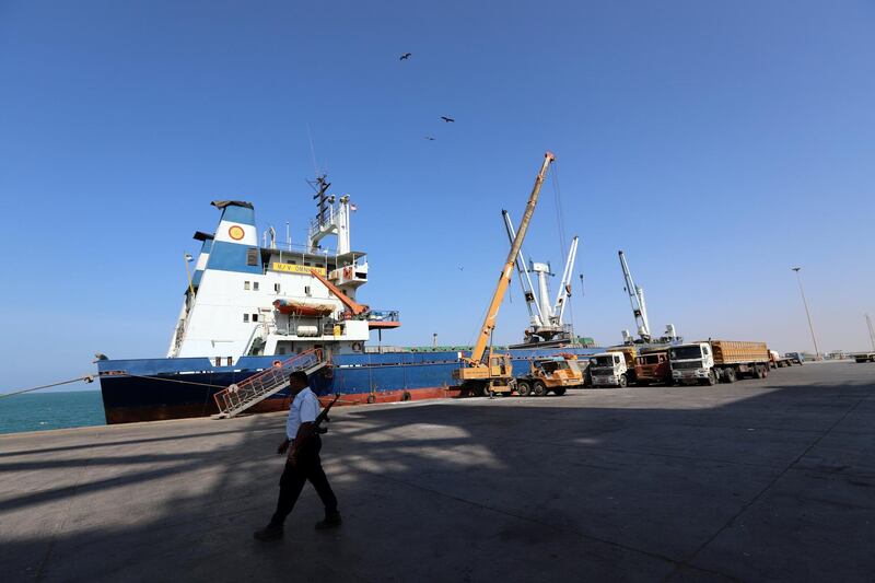 A coast guard walks past a ship docked at the Red Sea port of Hodeidah, Yemen January 5, 2019. Picture taken January 5, 2019. REUTERS/Abduljabbar Zeyad