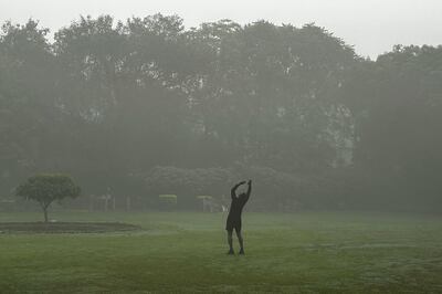 Early morning exercise in a smog-shrouded park in New Delhi on Friday. AP