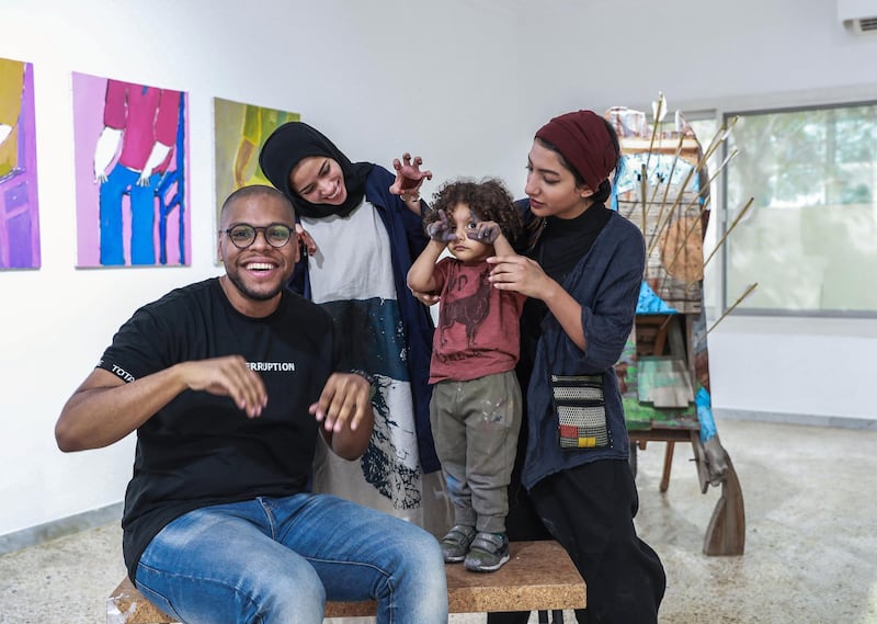 Abu Dhabi, U.A.E., June 6, 2018.    Bait 15 Studio and Art work space.  (L-R) Hashel Lamki, Afra Al Dhaheri and  Maitha Abdalla and son, Mubarak.
Victor Besa / The National
Reporter:   Melissa Gronlund  
Section:  Arts & Culture