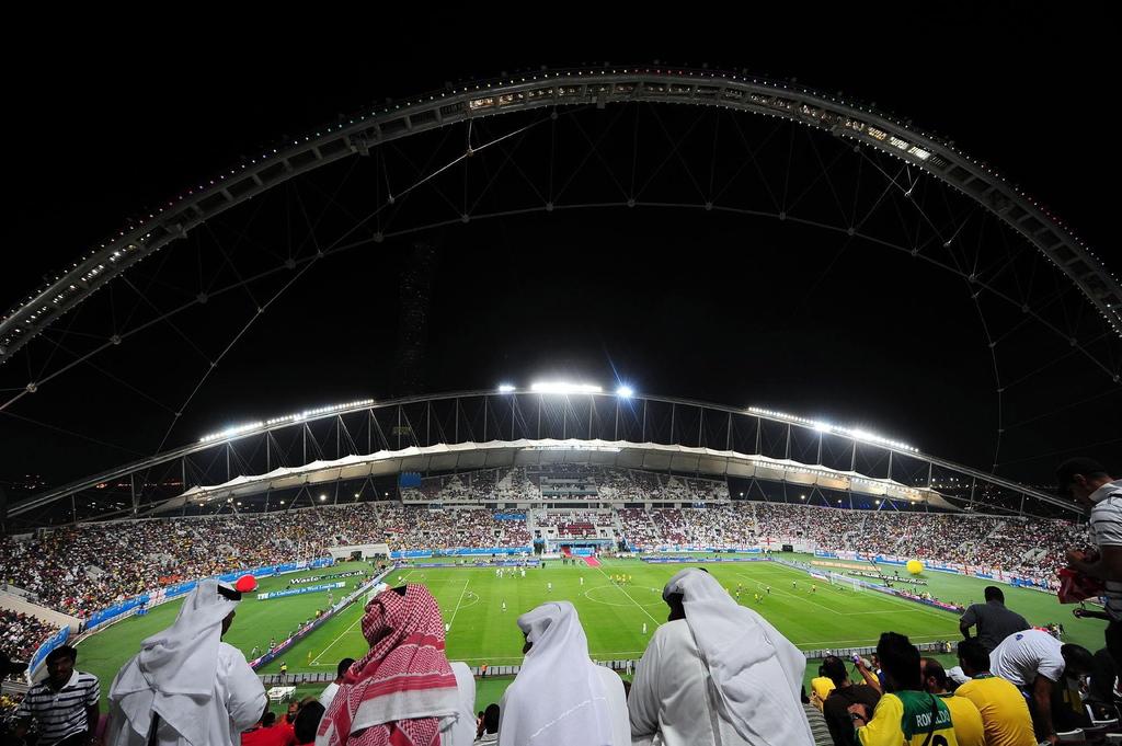 Fans shown watching a match at the Khalifa International Stadium in Doha in 2009. Owen Humphreys / PA / AP / November 14, 2009