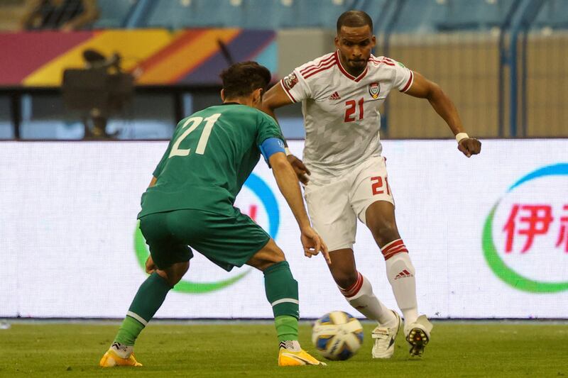 UAE defender Mahmoud Khamees takes on Iraq midfielder Saad Abdulameer. AFP