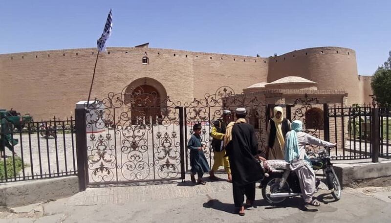 Taliban forces raise their flags at historical citadel after taking control of Herat, Afghanistan. EPA