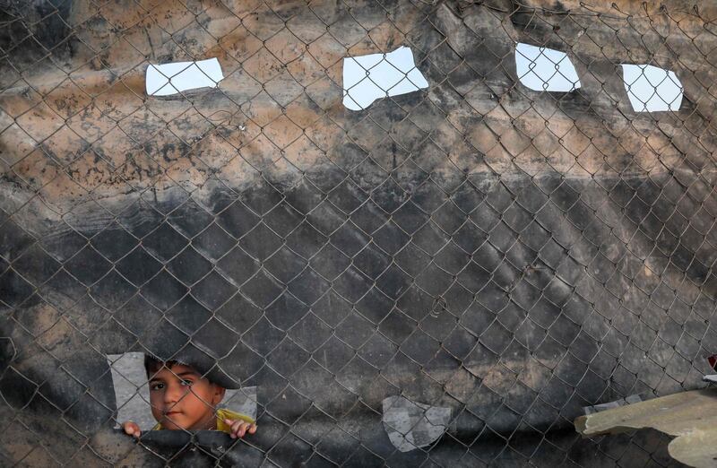 An Iranian Kurd refugee child at Bahrka refugee camp. Few asylum applications are accepted by the UN High Commissioner for Refugees, meaning residents remain stuck in limbo. AFP