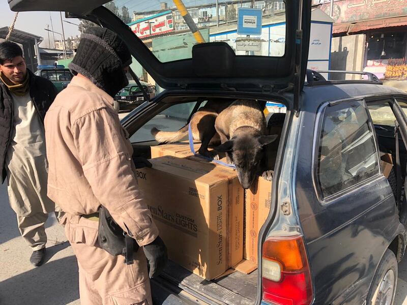 Afghan security officials check vehicles at a checkpoint in Kabul, Afghanistan. EPA