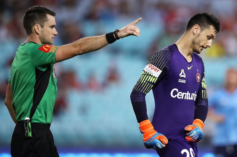 Referee Jarred Gillett sends Vedran Janjetovic of the Wanderers from the field after a straight red card for a hand ball during the round eight A-League match between the Western Sydney Wanderers and Sydney FC at ANZ Stadium in Sydney, Australia. Getty Images