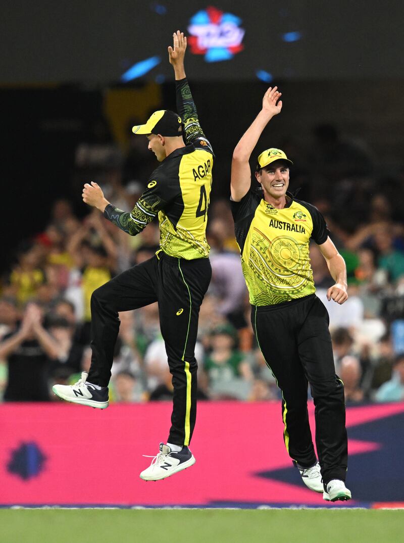 Pat Cummins, right, of Australia celebrates taking the wicket of Ireland captain Andrew Balbirnie. EPA 