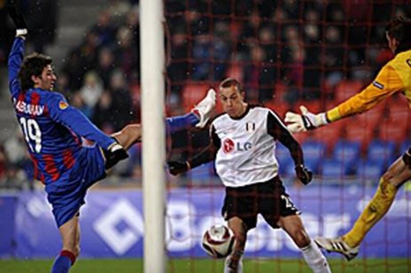 Bobby Zamora, centre, scores Fulham's second goal against Basel.
