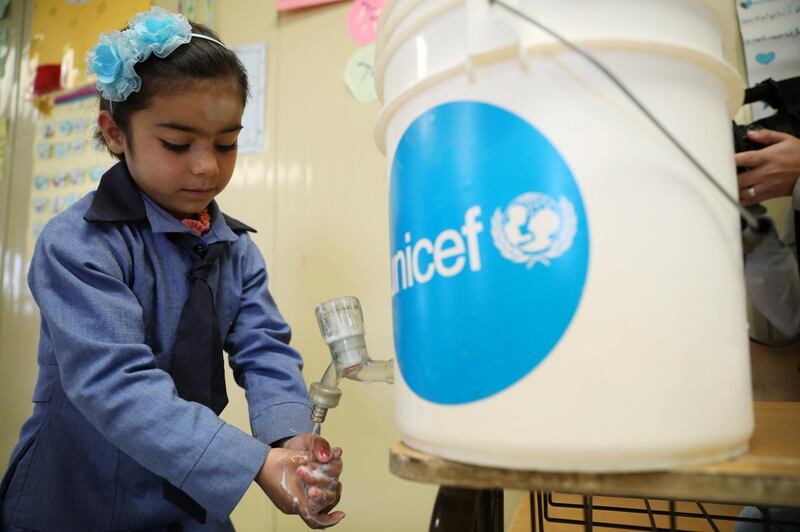 A Syrian refugee student takes part in a washing hands activity as part of an awareness campaign about coronavirus initiated by OXFAM and UNICEF at Al Zaatari refugee camp in the Jordanian city of Mafraq, near the border with Syria. Reuters