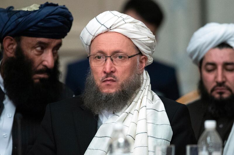 Taliban official Abdul Salam Hanafi, center, attends the "intra-Afghan" talks in Moscow, Russia, Wednesday, Feb. 6, 2019. Taliban official Abdul Salam Hanafi, speaking on the sidelines of a meeting in Moscow between the Taliban and other prominent Afghan figures, said that U.S. officials promised the pullout will begin this month. (AP Photo/Pavel Golovkin)