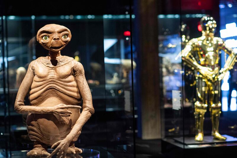 Artifacts of cinema, from films such as 'Star Wars' and 'ET' are displayed. AFP