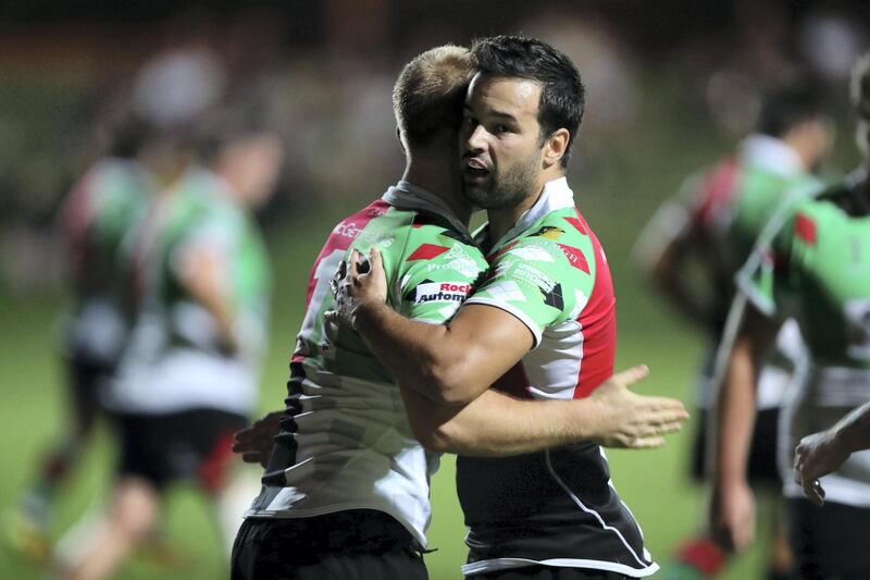 Abu Dhabi, United Arab Emirates - October 12, 2018: Quins' Kobus Cronje (L) scores a try in the game between Abu Dhabi Harlequins and Dubai Hurricanes in the West Asia Premiership. Friday, October 12th, 2018 at Zayed Sports City, Abu Dhabi. Chris Whiteoak / The National