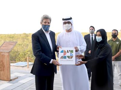 U.S. Special Presidential Envoy for Climate John Kerry poses alongside UAE Special Envoy for Climate Change and Abu Dhabi National Oil Company CEO, Sultan Ahmed Al Jaber, during a visit to Jubail Mangrove Park, in Abu Dhabi, United Arab Emirates April 3, 2021. WAM/Handout via REUTERS  ATTENTION EDITORS - THIS IMAGE WAS PROVIDED BY A THIRD PARTY.
