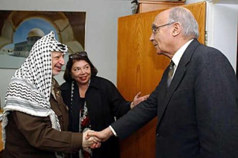 José Saramago, right, meets the Palestinian leader Yasser Arafat in the West Bank city of Ramallah in 2002. The Palestinian Authority's ambassador in Paris, Leila Shahid, is also seen.