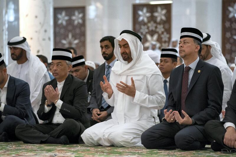 ABU DHABI, UNITED ARAB EMIRATES - June 14, 2019: HH Sheikh Mohamed bin Zayed Al Nahyan, Crown Prince of Abu Dhabi and Deputy Supreme Commander of the UAE Armed Forces (2nd R) and HM King Sultan Abdullah Sultan Ahmad Shah of Malaysia (3rd R), attend Friday prayers at the Sheikh Zayed Grand Mosque. Seen with members of the Malaysian delegation.

( Hamad Al Kaabi / Ministry of Presidential Affairs )​
---