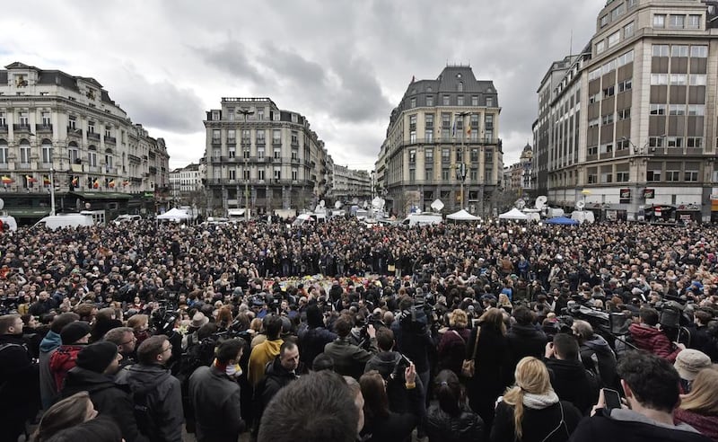 A minute of silence is observed at the Place de la Bourse in the centre of Brussels on March 23, 2016. Bombs exploded Tuesday at the city’s airport and one of its metro stations, killing and wounding scores of people, as a European capital was again locked down amid heightened security threats. Martin Meissner/ Associated Press