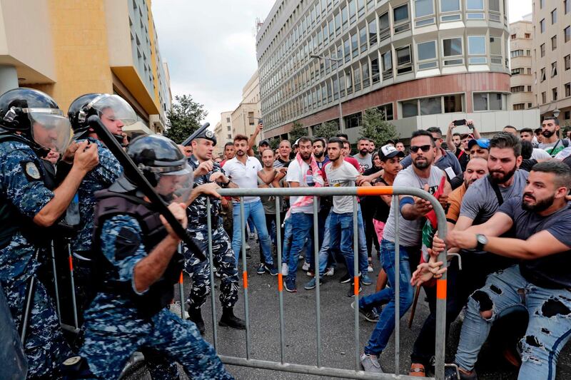 Lebanese protesters clash with riot policemen. AFP