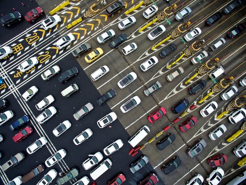 Cars line up near a toll station on the first day of China’s National Day holiday, in Nanjing, Jiangsu province, China. Reuters / Stringer