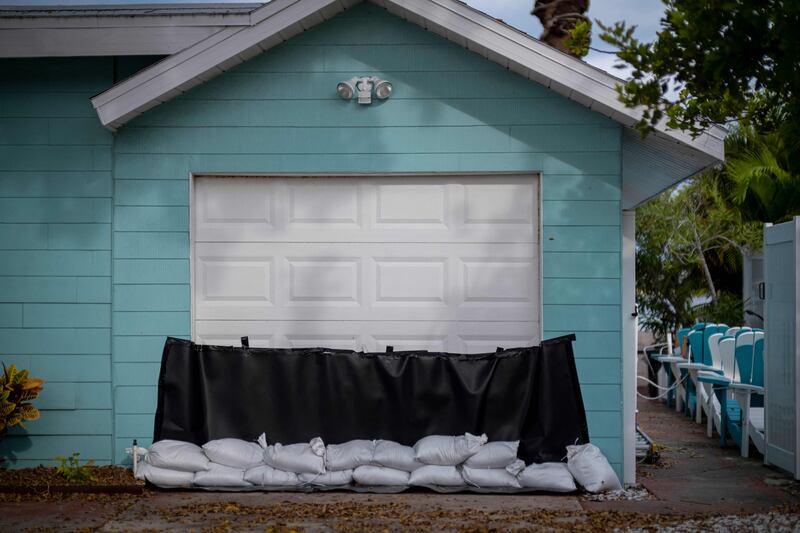 Sandbags in front of a garage door as a flood precaution in St Pete Beach, Florida. AFP