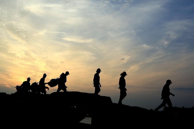 Tom Watson, Miguel Angel Jimenez and Bernhard Langer walk over the Swilken Bridge during the second round of the Senior Open at The Old Course in St Andrews, Scotland. Phil Inglis/Getty Images