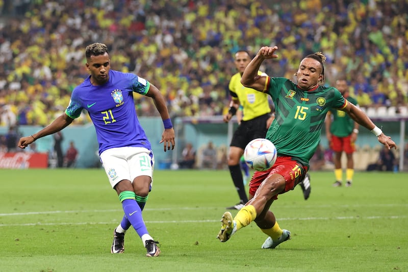 Cameroon's Pierre Kunde attempts to block a shot by Rodrygo of Brazil. Getty