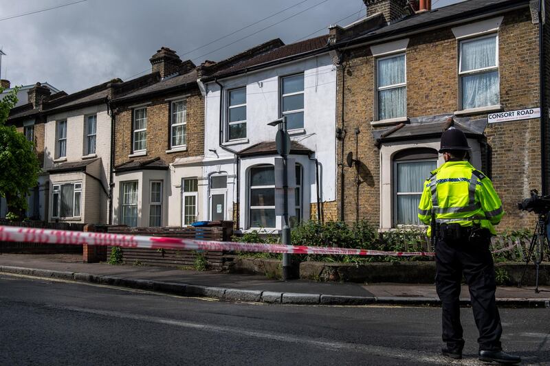 A police officer stands at a cordon on Consort Road where they are investigating the shooting. Getty Images