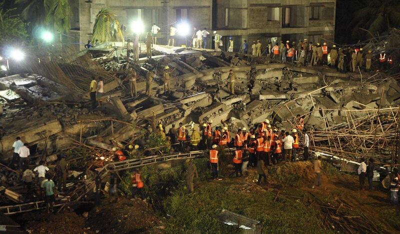 Rescue workers conduct a search operation for survivors at the site of a collapsed 12-storey building on the outskirts of Chennai. Babu / Reuters