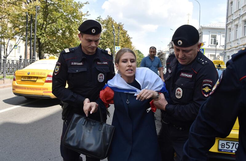 Police officers detain an opposition politician Lyubov Sobol, one of the candidates barred from elections to Moscow City Duma, the capital's regional parliament, before a rally in Moscow, Russia July 27, 2019. REUTERS/Stringer NO RESALES. NO ARCHIVES