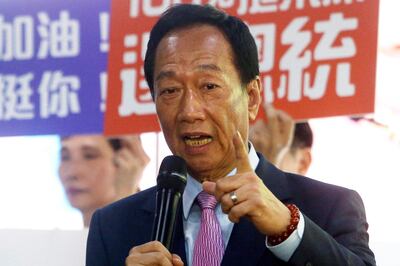 FILE - In this June 21, 2019, file photo, Terry Gou, chairman of Foxconn, the world's largest contract assembler of consumer electronics, speaks to the media after the company's annual shareholders meeting in New Taipei City, Taiwan. Gou has given up on making a bid for Taiwan's presidency. Gao announced his decision in a statement late Monday, Sept. 16, 2019,  one day before a deadline to register for the race. (AP Photo/Chiang Ying-ying, File)