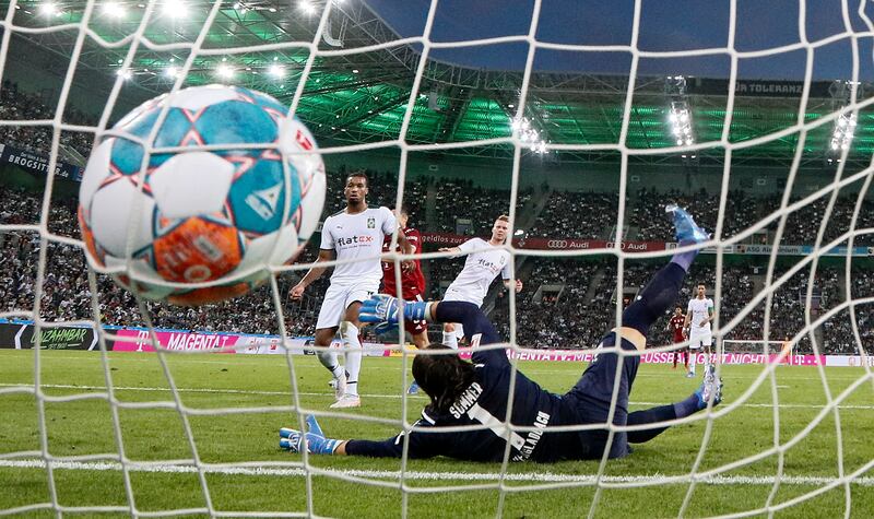 Gladbach's goalkeeper Yann Sommer is beaten by Lewandowski.