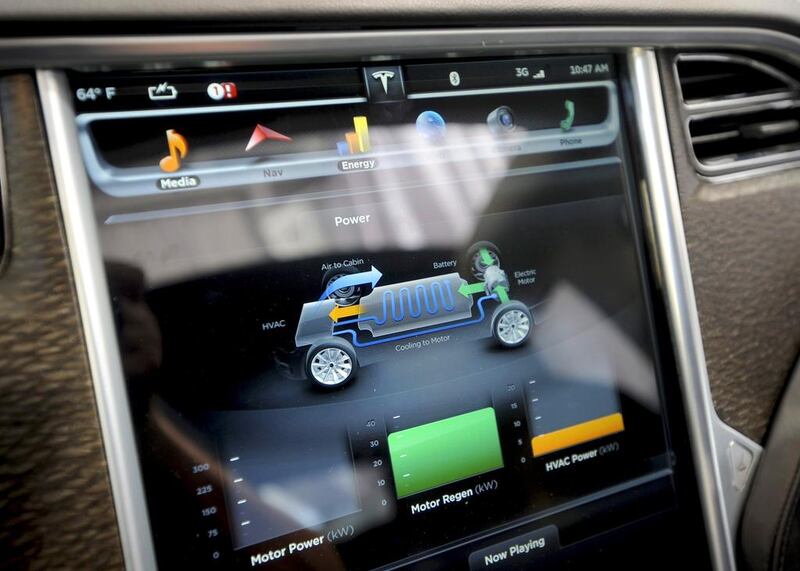 A console screen displays information in a Tesla Model S electric car. Noah Berger / Reuters