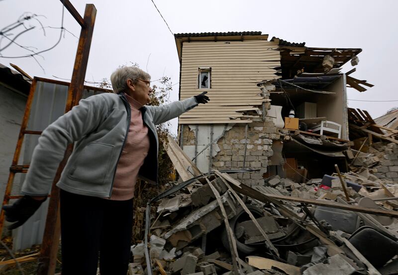 A local resident stands on the ruins of a house destroyed by recent shelling in Donetsk. Ukraine is seeking financial damages from Russia for the destruction caused since its invasion. Reuters