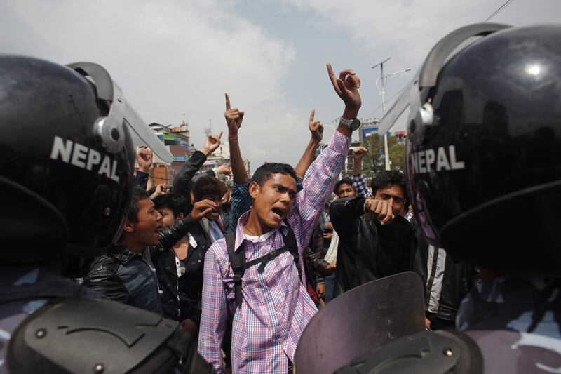 Nepalese citizens block traffic and shout slogans against the government on April 29, 2015, as they protest the slow pace of aid delivery following the earthquake. Niranjan Shrestha/AP Photo