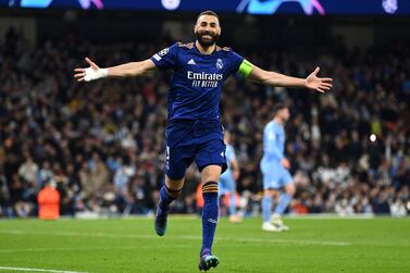 MANCHESTER, ENGLAND - APRIL 26: Karim Benzema of Real Madrid celebrates after scoring their side's third goal from the penalty spot during the UEFA Champions League Semi Final Leg One match between Manchester City and Real Madrid at Etihad Stadium on April 26, 2022 in Manchester, England. (Photo by David Ramos / Getty Images)