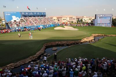 DUBAI, UNITED ARAB EMIRATES - NOVEMBER 19:  Jon Rahm of Spain shakes hands with Dean Burmester of South Africa on the 18th green during the final round of the DP World Tour Championship at Jumeirah Golf Estates on November 19, 2017 in Dubai, United Arab Emirates.  (Photo by Andrew Redington/Getty Images)