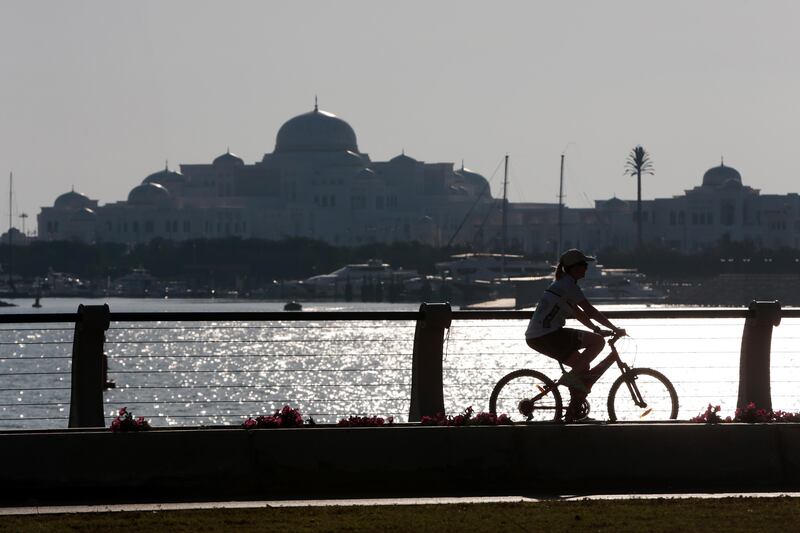 Abu Dhabi, United Arab Emirates, January 8, 2017:    A woman rides her bicycle past the Presidential Palace in the Al Marina area of Abu Dhabi on January 8, 2017. Christopher Pike / The National

Job ID: 
Reporter:  N/A
Section: News
Keywords:  *** Local Caption ***  CP0108-na-stand alone01.JPG