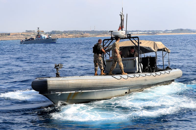 Lebanese soldiers patrol near an Israeli navy vessel during the demonstration. AP Photo