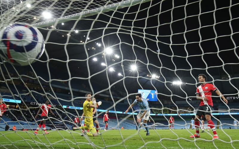 Manchester City's Ilkay Gundogan, centre, scores his side's third goal during Wednesday's 5-2 Premier League triumph over Southampton at the Etihad Stadium in Manchester, England. AP Photo